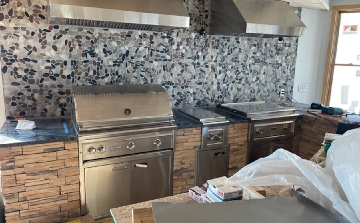 outdoor kitchen with electric fan installation